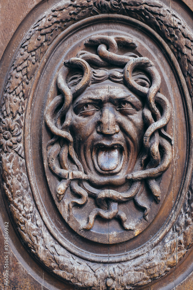 Ornate carving on wood door, Paris, France Ornate carving on wood door, Paris, France