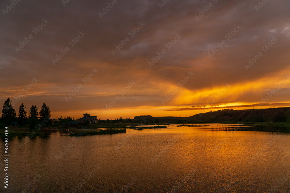 sunset over a small lake in summer in Bashkiria