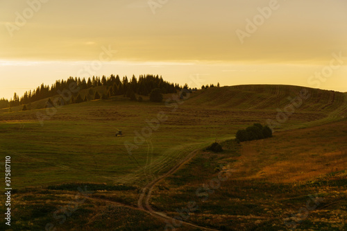 sunset over hilly fields in summer in Bashkiria