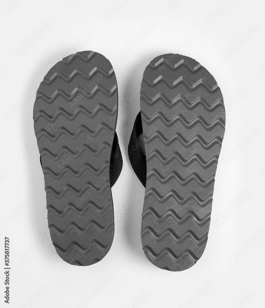 Pair of black rubber sole flip-flops isolated on white background