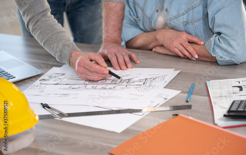 Architects working on house sketch
