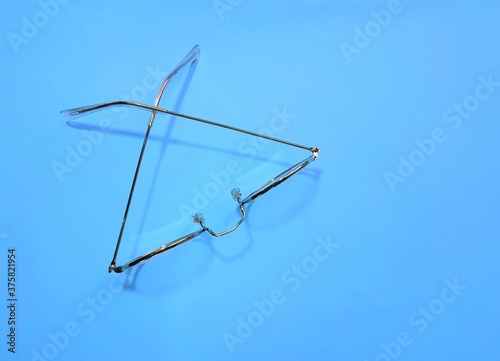 doctor glasses on a blue background top view. Medical color concept. Background. Blank for design.