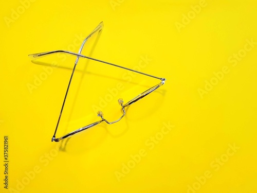glass of water. Glasses top view on a yellow beautiful background.