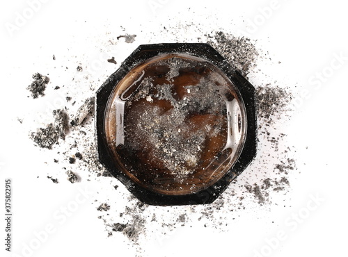 Glass ashtray with cigarette ash isolated on white background, top view