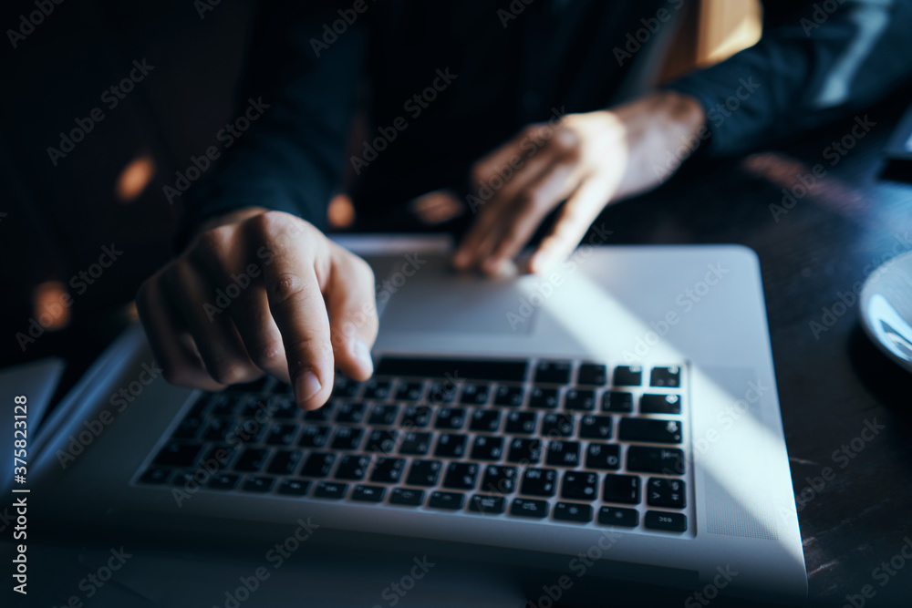 Business man freelancer working in a cafe laptops communication phone room manager model Business man freelancer working in a cafe laptops communication phone room manager model