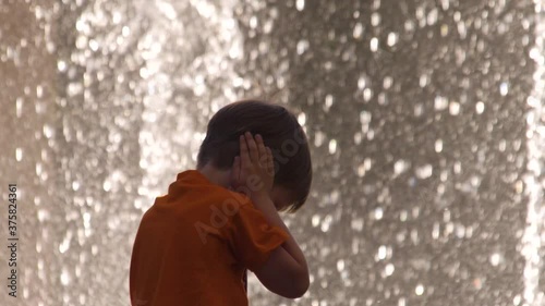 Kid covers his ears with hands to protect from noise. Denial conception. Child negative reaction, emotions on surroundings, environment. Pediatrics background. Psychology concept. Intense sensitivity