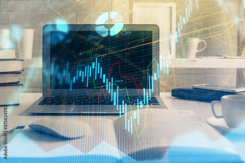 Forex market chart hologram and personal computer background. Double exposure. Concept of investment. Forex market chart hologram and personal computer background. Double exposure. Concept of investment.