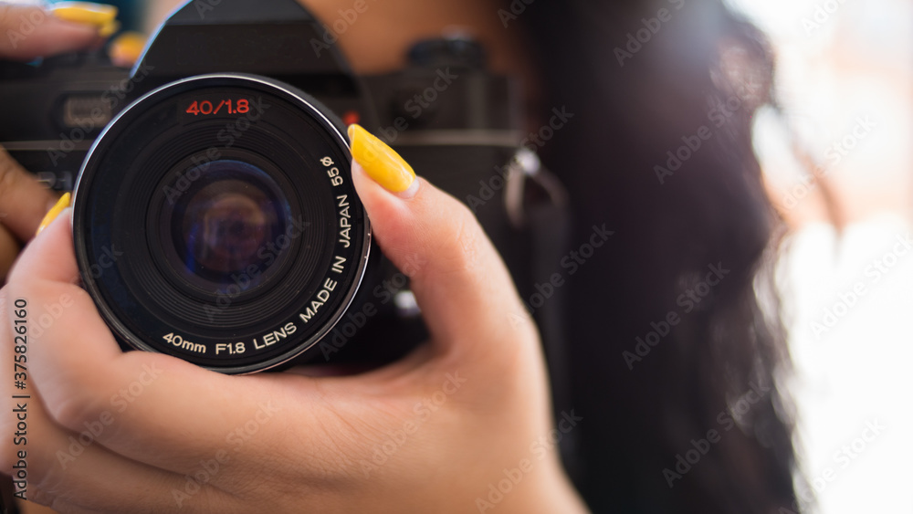 WOMAN FOCUSING WITH CAMERA 02