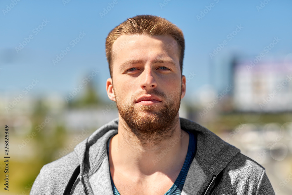 fitness, sport and people concept - portrait of young man outdoors fitness, sport and people concept - portrait of young man outdoors