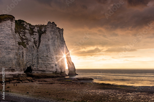 Obraz na plátně Famouse cliffs of Etretat, france, at sunset