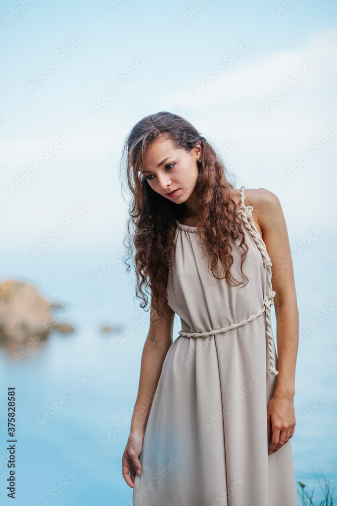 Sensual portrait of beautiful woman by the sea Sensual portrait of beautiful woman by the sea