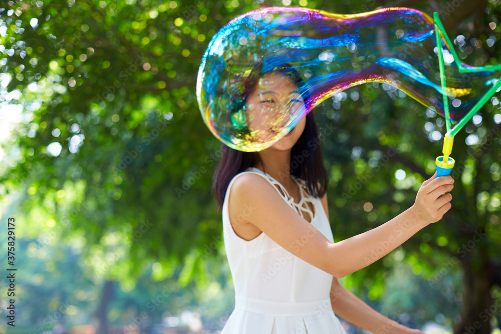 happy young asian woman playing bubble outdoor happy young asian woman playing bubble outdoor