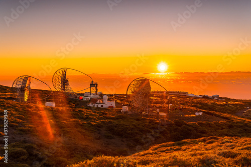 The new astronomical observatory of the Caldera de Taburiente in a beautiful orange sunset, La Palma, Canary Islands. Spain