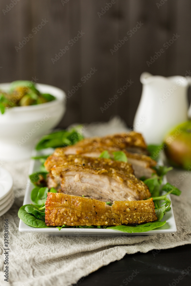 Roast pork belly joint with crackling for dinner Roast pork belly joint with crackling for dinner