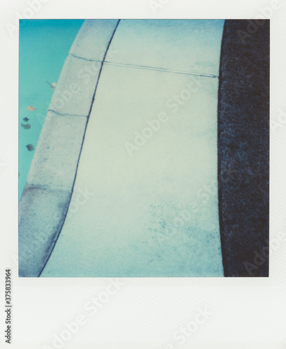 Walkway along outer edge of swimming pool (Polariod SX-70 print) photo