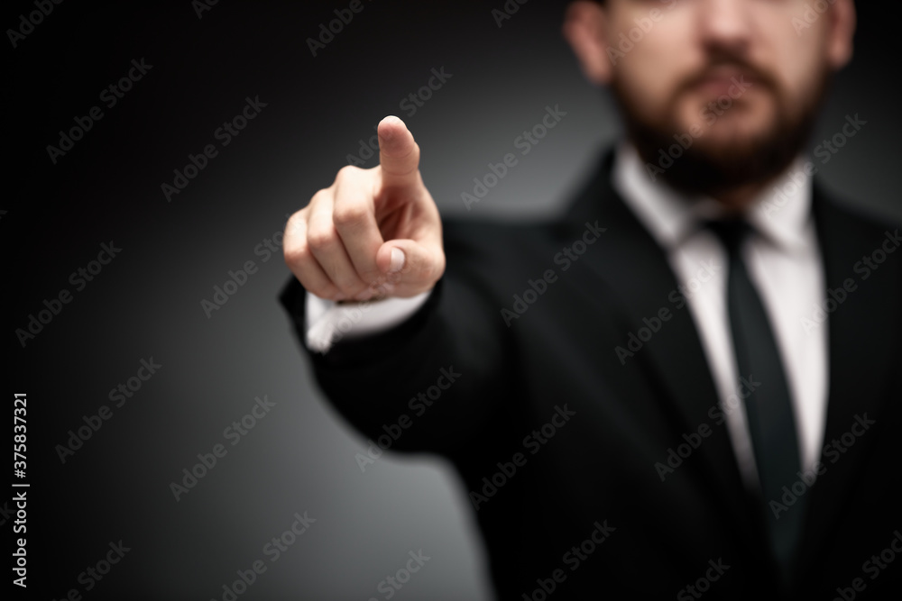 Businessman pointing finger forward Businessman pointing finger forward