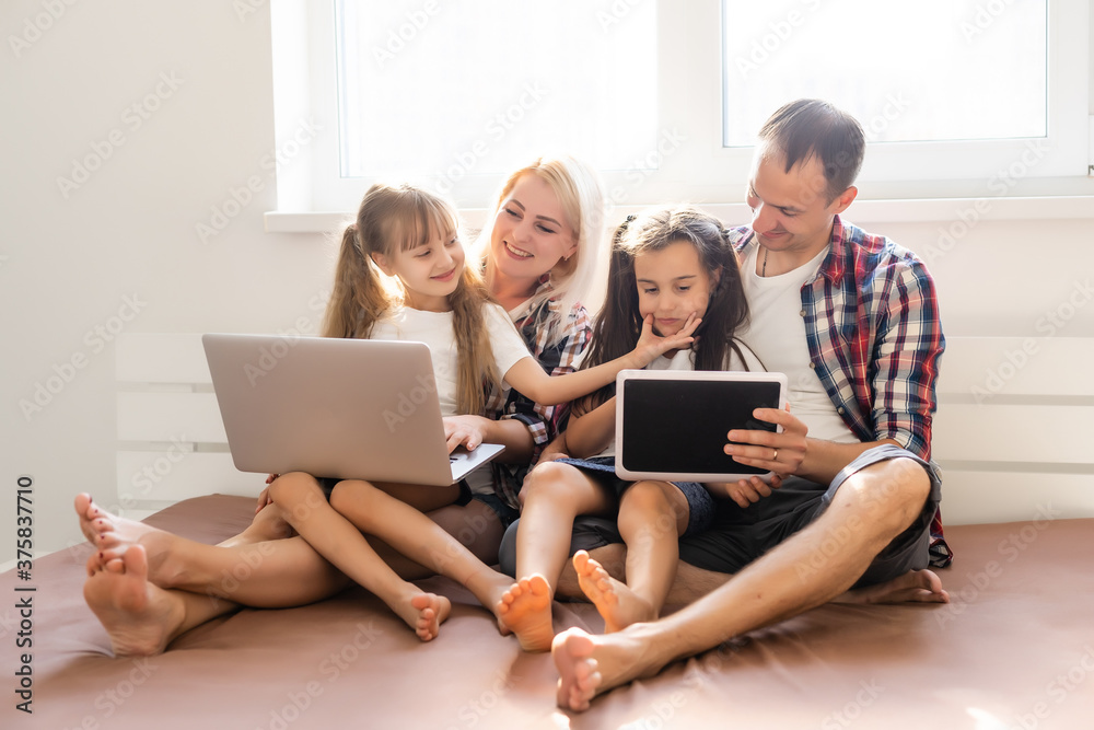 Animated family buying online lying down on bed at home Animated family buying online lying down on bed at home