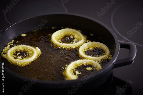 Preparing fried onion rings photo