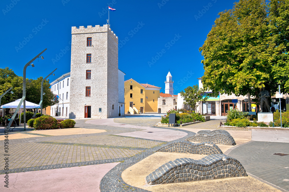 Town of Novi Vinodolski tower and old stone square view