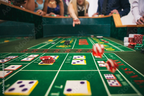 Casino: Woman Gives Dice A Throw In Craps Game photo