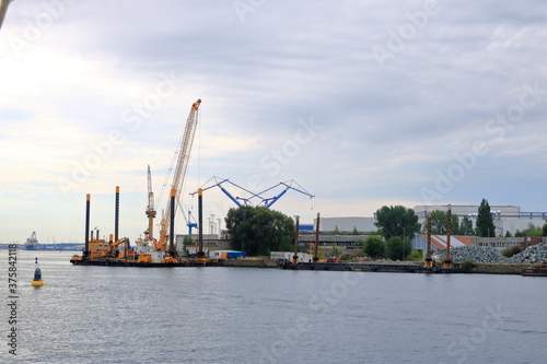 August 21 2020 - Rostock-Warnemünde, Mecklenburg-Vorpommern/Germany: Details of the industry port and dockside cranes at the europort harbour in Rostock © Dynamoland