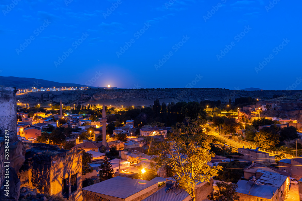Incesu district in Kayseri province. night view of Incesu city with full moon