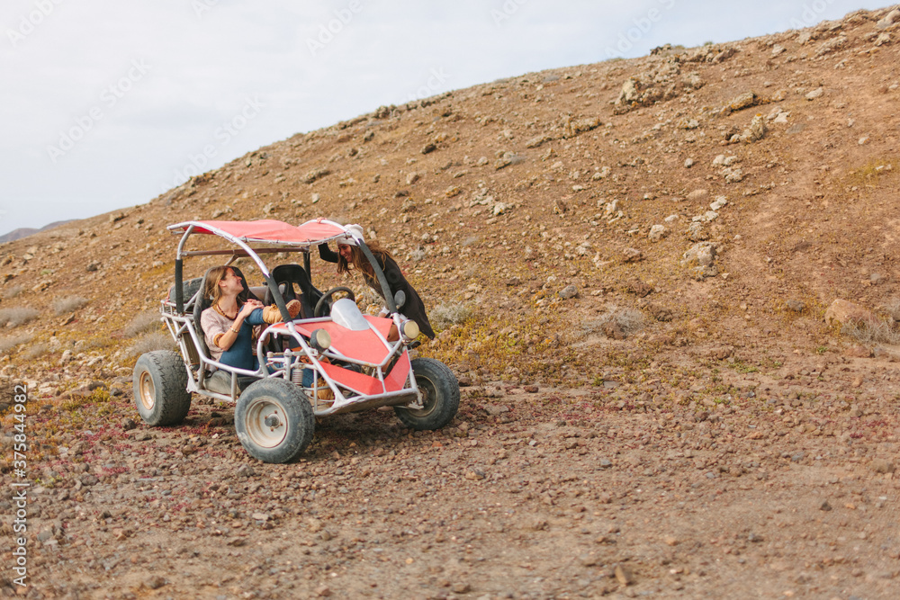Female Friends in Adventure in the Desert With Buggy Female Friends in Adventure in the Desert With Buggy