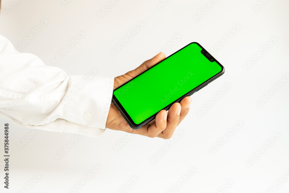 hand holding smartphone with green screen hand holding smartphone with green screen