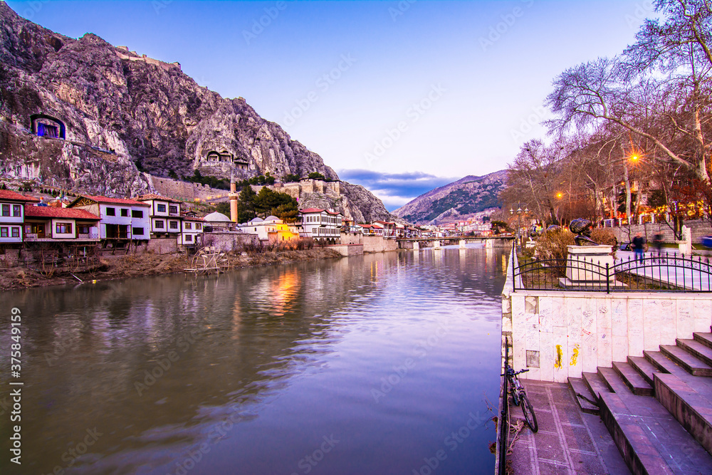 Old Ottoman houses view by the Yesilirmak River in Amasya City. Amasya is popular tourist destination in Turkey. 