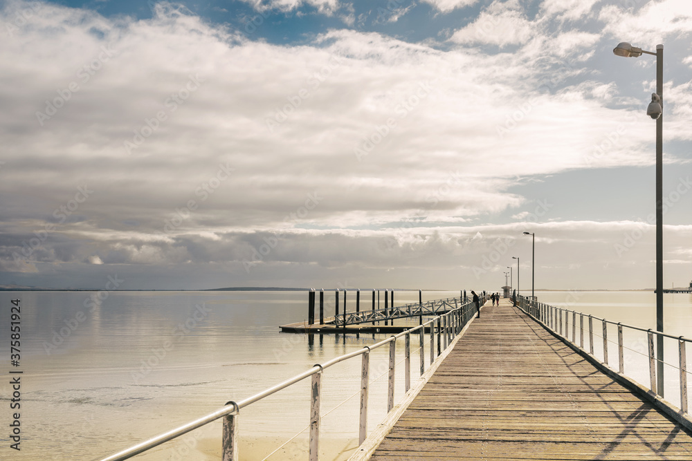 empty jetty leading to the sea