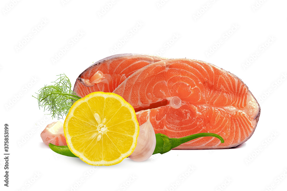 fresh trout steak with lemon, garlic and hot pepper on a white background fresh trout steak with lemon, garlic and hot pepper on a white background