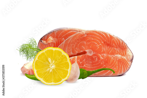 fresh trout steak with lemon, garlic and hot pepper on a white background