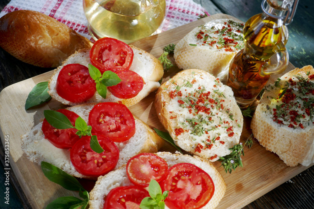 top-view of a  healthy sandwiches with  tomato and basil ,savory, olive oil on table.