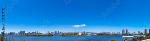                                                                                                                     Scenery of Tokyo Bay area and Rainbow Bridge. High resolution wide panorama.