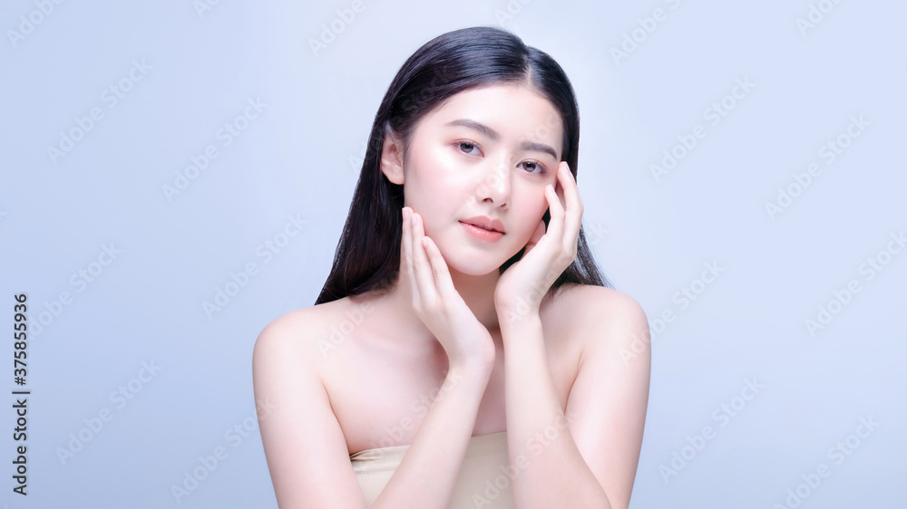 Asian woman beauty shot with half naked isolated on blue background with clean fresh skin. Asian woman beauty shot with half naked isolated on blue background with clean fresh skin.