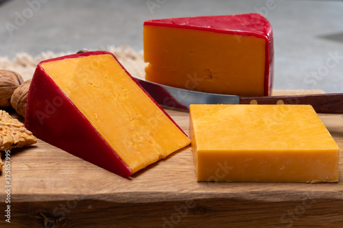 Red waxed yellow cheddar cheese close up