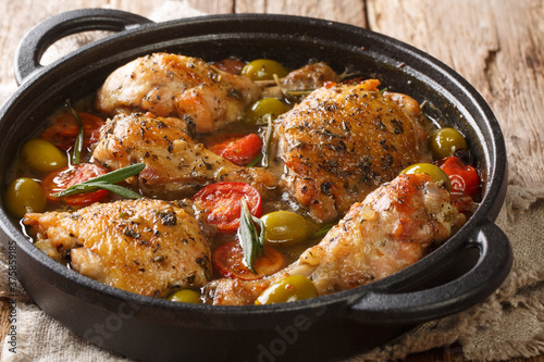 Εκτύπωση καμβά Rustic style chicken baked with green olives, tomatoes and onions, herbs close-up in a pan on the table