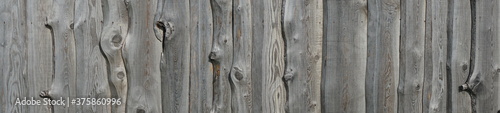 Old gray wooden fence. Wood texture background. Banner with rustic texture for your design.