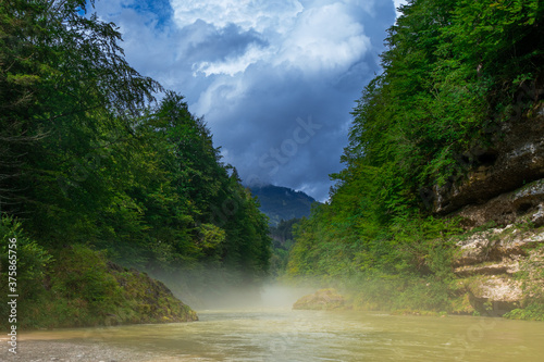 alpine river with the mist 