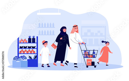 Arab family shopping in grocery store. Happy couple in Muslim with two kids in Muslim clothes wheeling cart along supermarket aisles. For shopping, buying food, Arabic people concept