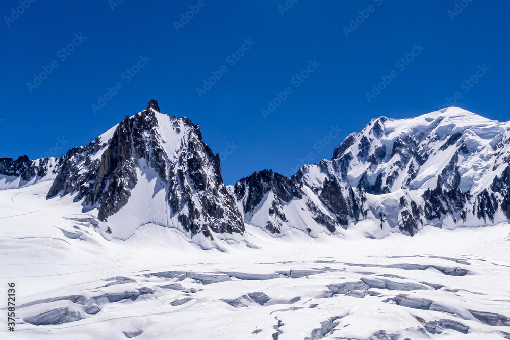 Snow covered peaks of the Alps mountains range