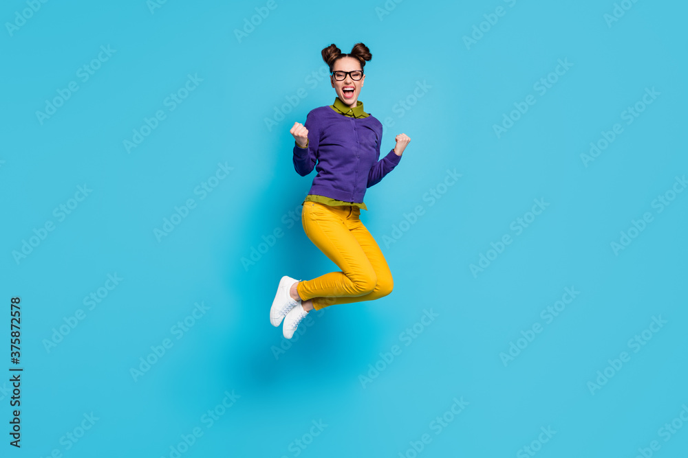 Full length profile photo of pretty crazy lady two buns jump high celebrate college graduating excellent degree diploma wear specs shirt pullover pants isolated blue color background