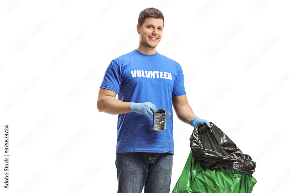 Fototapeta premium Young male volunteer holding a bag and a tin can