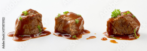 Three diced cubes of beef goulash and gravy