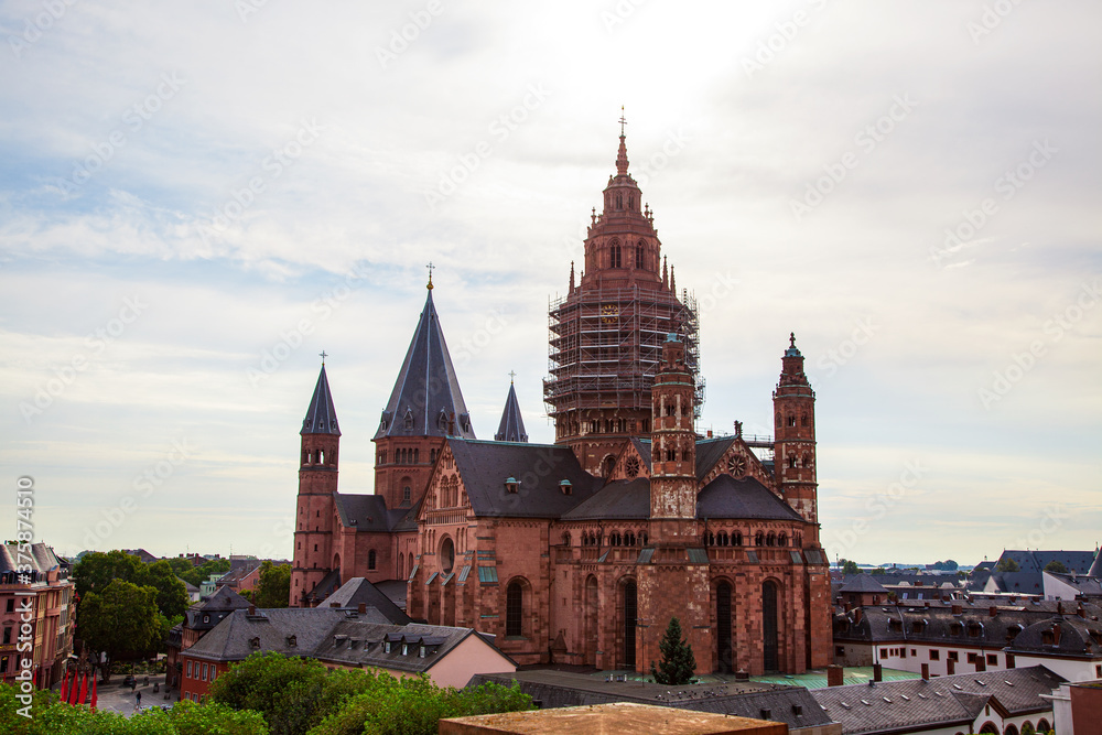 Mainz - Rhineland Palatinate, Germany - High Cathedral of St. Martin, Mainzer Dom. scaffolding on facade. Roman Catholic Cathedral, Romanesque as well as Gothic and Baroque elements. aerial view