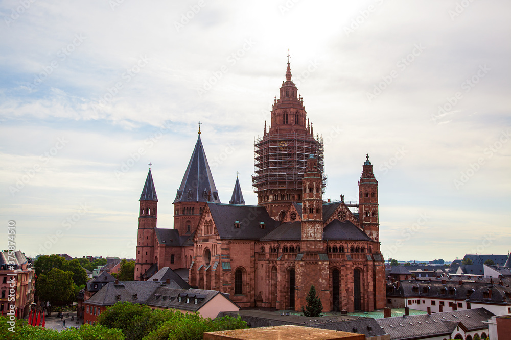 Mainz - Rhineland Palatinate, Germany - High Cathedral of St. Martin, Mainzer Dom. scaffolding on facade. Roman Catholic Cathedral, Romanesque as well as Gothic and Baroque elements. aerial view Mainz - Rhineland Palatinate, Germany - High Cathedral of St. Martin, Mainzer Dom. scaffolding on facade. Roman Catholic Cathedral, Romanesque as well as Gothic and Baroque elements. aerial view