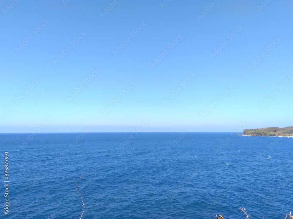 Beautiful scenery of blue beach. Tambakrejo beach, the one of beautiful indonesian beach in Blitar, East Java, Indonesia. Beautiful scenery of blue beach. Tambakrejo beach, the one of beautiful indonesian beach in Blitar, East Java, Indonesia.