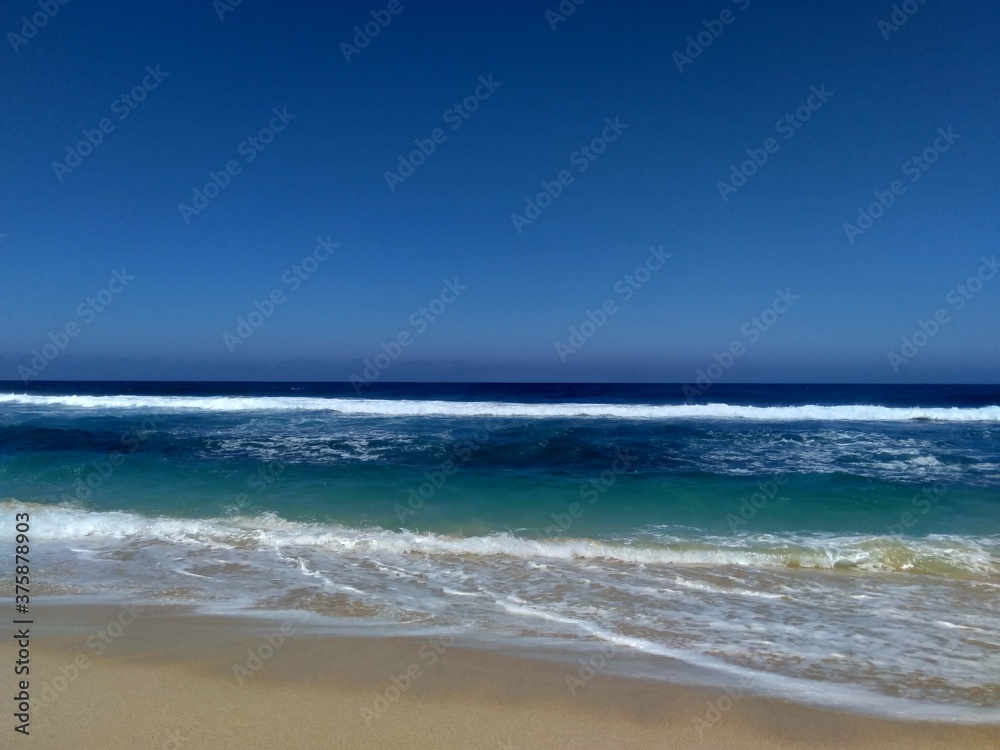 Beautiful scenery of blue beach. Tambakrejo beach, the one of beautiful indonesian beach in Blitar, East Java, Indonesia.
