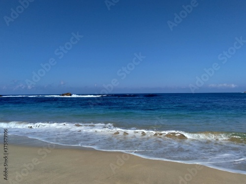 Beautiful scenery of blue beach. Tambakrejo beach  the one of beautiful indonesian beach in Blitar  East Java  Indonesia.