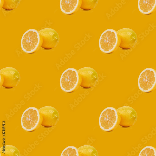 Geometric seamless pattern of yellow bright lemons on a yellow background.